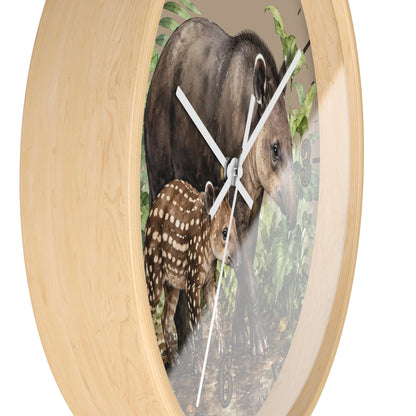 close up of a natural wood frame clock with the design of a Tapir mother and baby surrounded by the jungle forest on a white background.