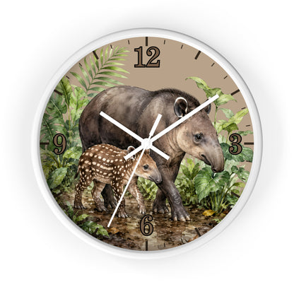 Round wall clock with a white frame and a printed tropical scene featuring a large tapir and a baby tapir among green leaves, with black Arabic numerals on a tan background.