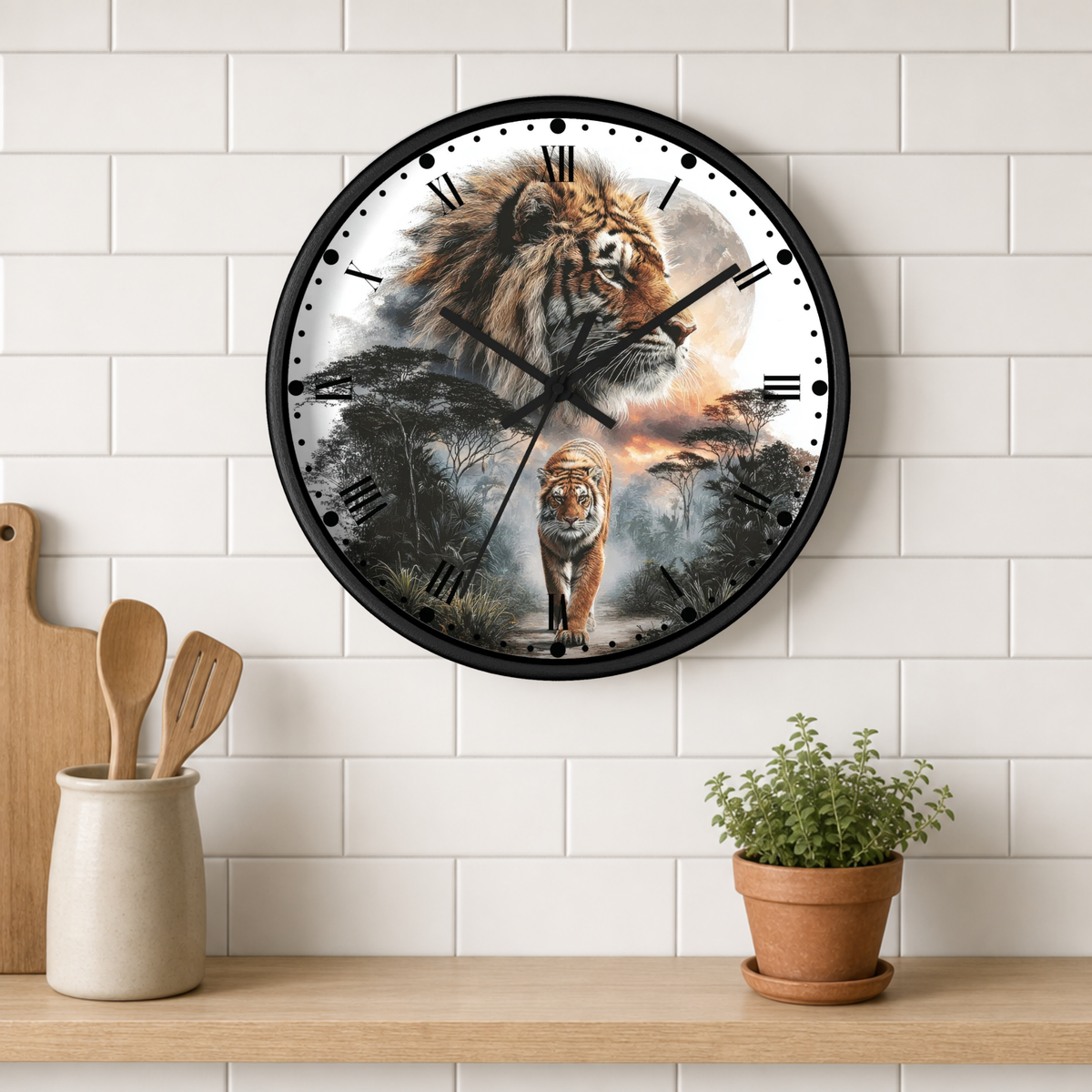 A round wall clock with a black frame and a printed design of a tiger in a savanna scene, mounted on a white subway tile wall above a wooden shelf with kitchen utensils and a potted plant.