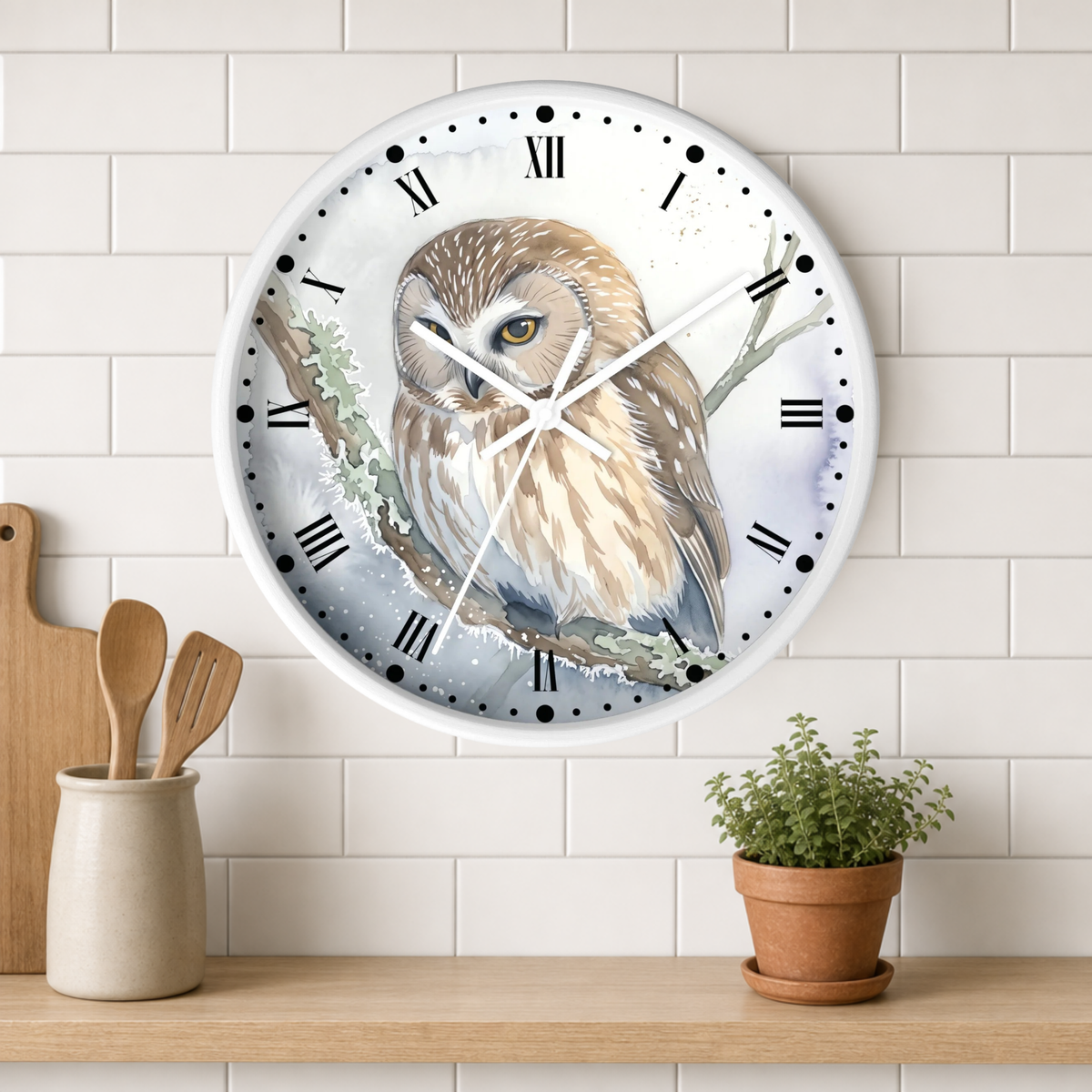 A round wall clock with a detailed owl illustration on the face, mounted on a white subway tile wall above a wooden shelf with kitchen utensils and a small potted plant.