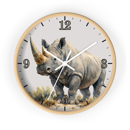 A round wall clock with a light wood frame and a printed rhinoceros illustration on the face. The clock has black Arabic numerals and black hour markers, with white clock hands.
