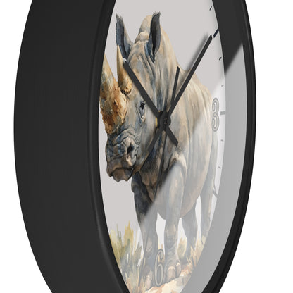 side close up of a black framed wood clock with a watercolor illustration of a Rhinoceros in tall safari grass on a white  background.
