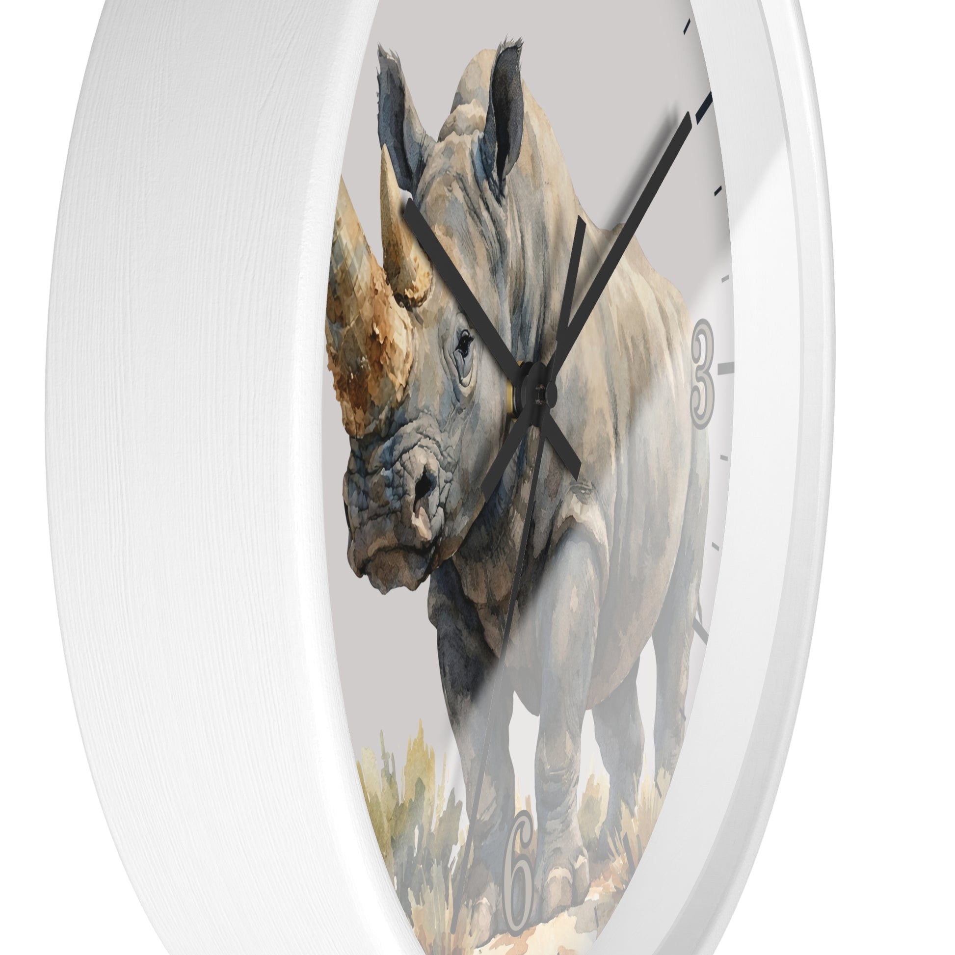 side close up of a white wood framed clock with a watercolor illustration of a rhinoceros in tall grass on a white background.