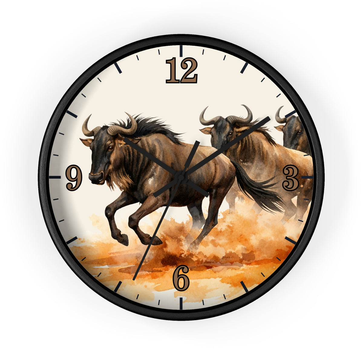 A round wall clock with a black frame and a printed design of three brown wildebeest running across an orange and cream landscape. The numbers 1 through 12 are displayed in a gold-toned serif font, and the clock hands are black.