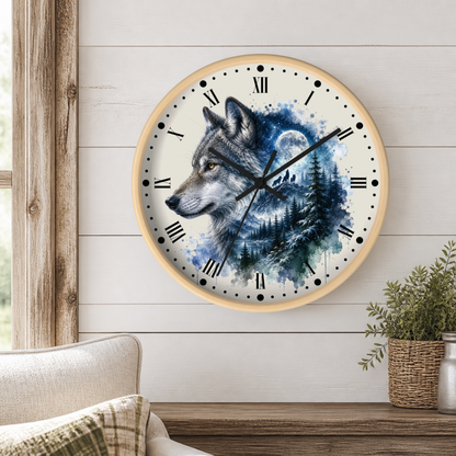 A round wall clock with a light wood frame hangs on a white shiplap wall above a wooden table. The clock face features a detailed illustration of a gray wolf in profile over a blue and white forest scene with a full moon.