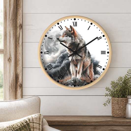 A round wall clock with a light wood frame hangs on a white shiplap wall above a wooden table. The clock face features a detailed illustration of a wolf sitting on a rock against a stormy sky.