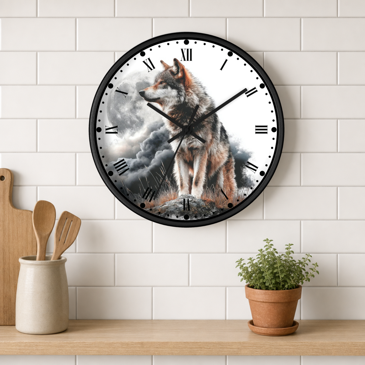 A round wall clock with a black frame hangs on a white subway tile wall above a wooden shelf. The clock face features a detailed illustration of a wolf standing in a stormy landscape.