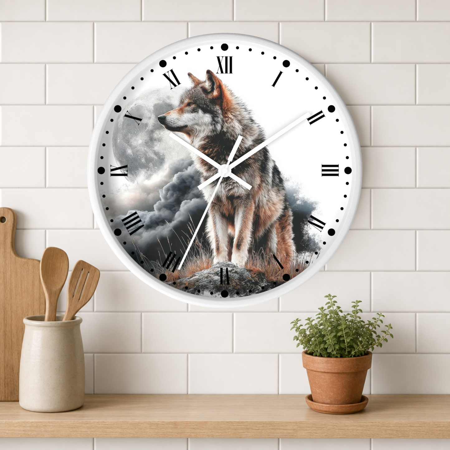 A round wall clock with a white frame and Roman numerals, featuring a printed graphic of a wolf standing in a stormy landscape. The clock is mounted on a white subway tile wall above a wooden shelf with a small potted plant and wooden utensils.