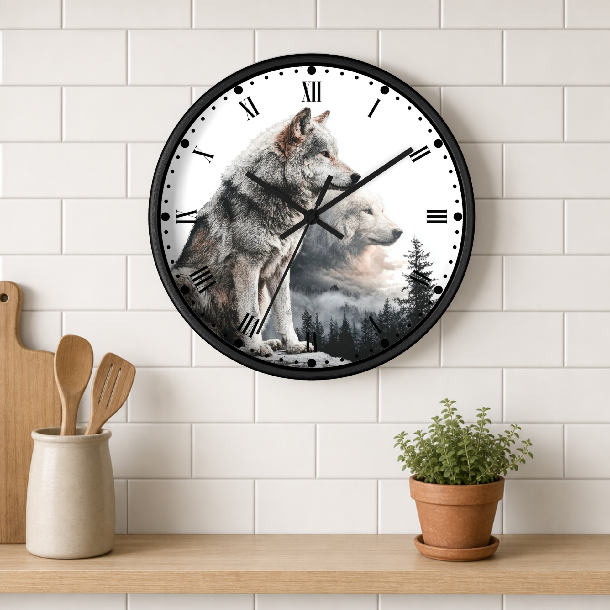 A round wall clock with a black frame and a wolf-themed printed face hangs on a white subway tile wall above a wooden shelf with a small potted plant and utensils.