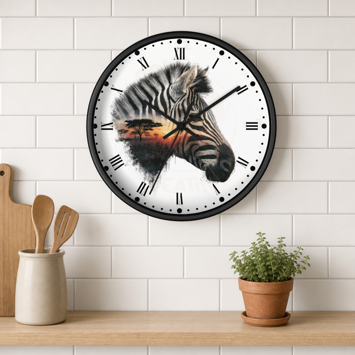 A round wall clock with a black frame hangs on a white subway-tile wall above a wooden shelf. The clock face features a painted zebra head with an African savanna sunset reflection.