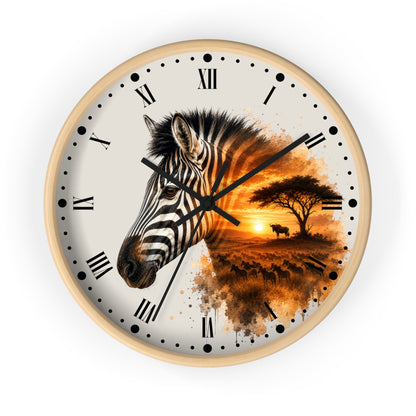 A round wall clock with a light wood frame, featuring a split design: one half shows a close-up zebra head in black and white, and the other half shows an African savanna sunset scene in warm orange and brown tones. The clock face is off-white with black Roman numerals and black hands.