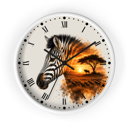 A round wall clock with a white frame and Roman numeral hour markers, featuring a split design: one half shows a close-up zebra head, and the other half shows an African savanna sunset scene with acacia trees and a bird. The clock is photographed against a clean white background.