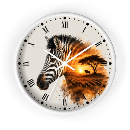 A round wall clock with a white frame and a split design: one half shows a close-up zebra head in black and white, and the other half shows an African savanna sunset scene in orange and brown tones. The clock face is off-white with black Roman numerals and white hands.