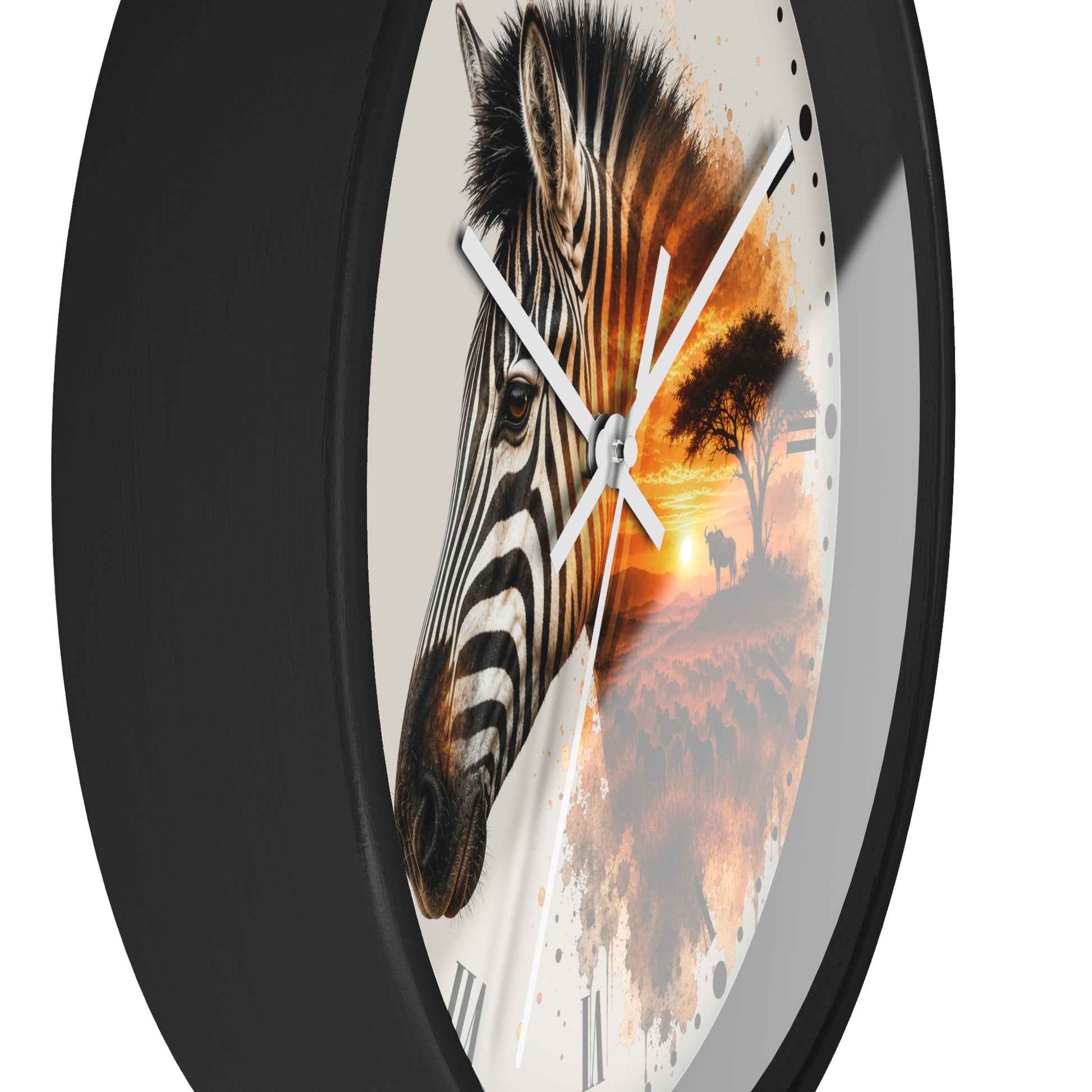 A round wall clock with a black frame and a printed face featuring a zebra head on the left and a warm sunset landscape on the right, shown against a plain white background.